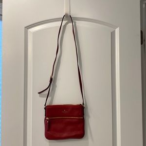 User Kate Spade red crossbody pocketbook. Used once